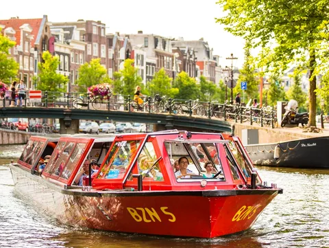 Amsterdam hop-on hop-off boat cruising the UNESCO-listed canal ring